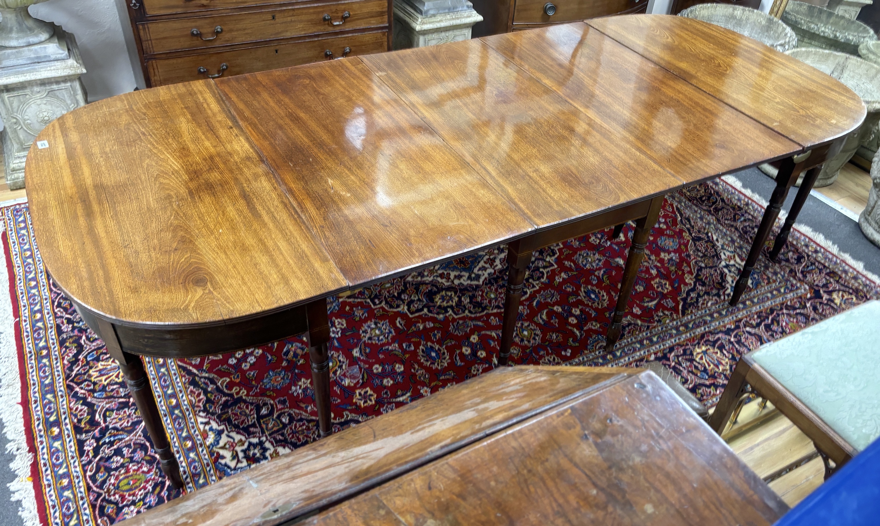 A Regency mahogany D end extending dining table, 257cm extended, width 109cm, height 70cm